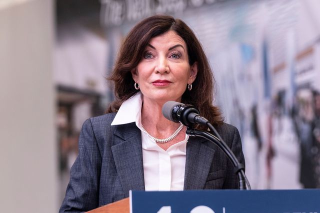 Gov. Kathy Hochul, at a podium, speaks during announcement with MTA Chair and CEO Janno Lieber at LIRR Concourse at Penn Station on Sept. 6th. The governor plans to lift most of her emergency powers related to COVID-19 on Sept. 13th.